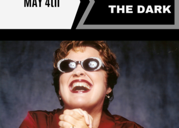 concert in the dark, May 4th, photo of woman in sunglasses smiling
