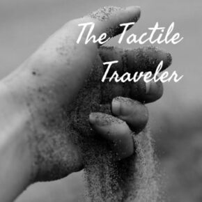 The tactile traveler with photo of sand falling through fingers